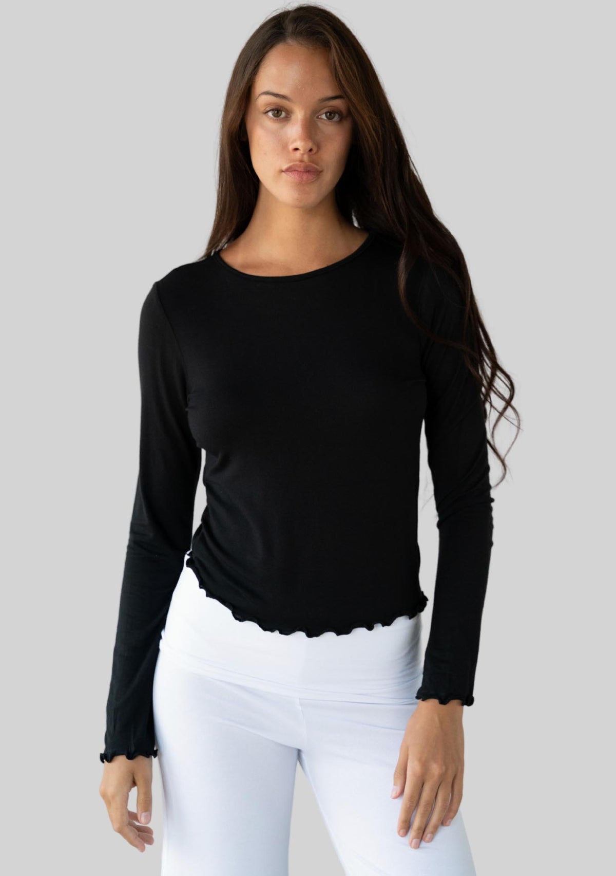 Jala Chill Top in Black - model photo. [label] Amelia is 5'9" S