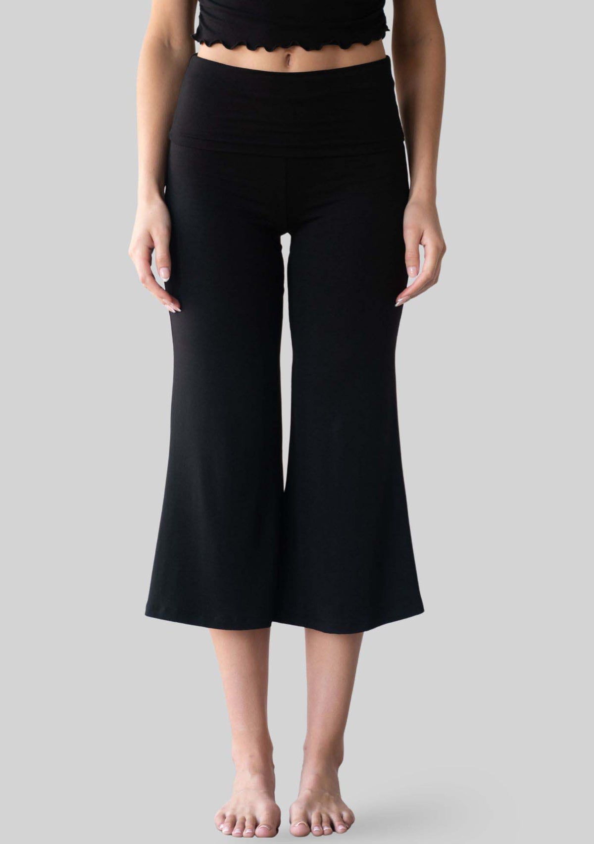 Jala Chill Yoga Capri in Black - front view. [label] Athena is 5'9" XS