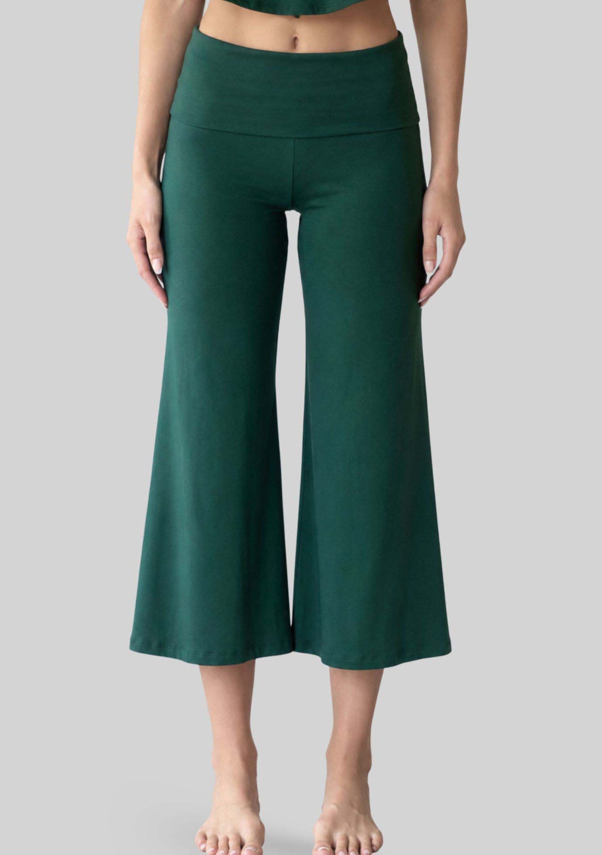 Evergreen Chill Yoga Capri, front view. [label] Athena is 5'9" XS