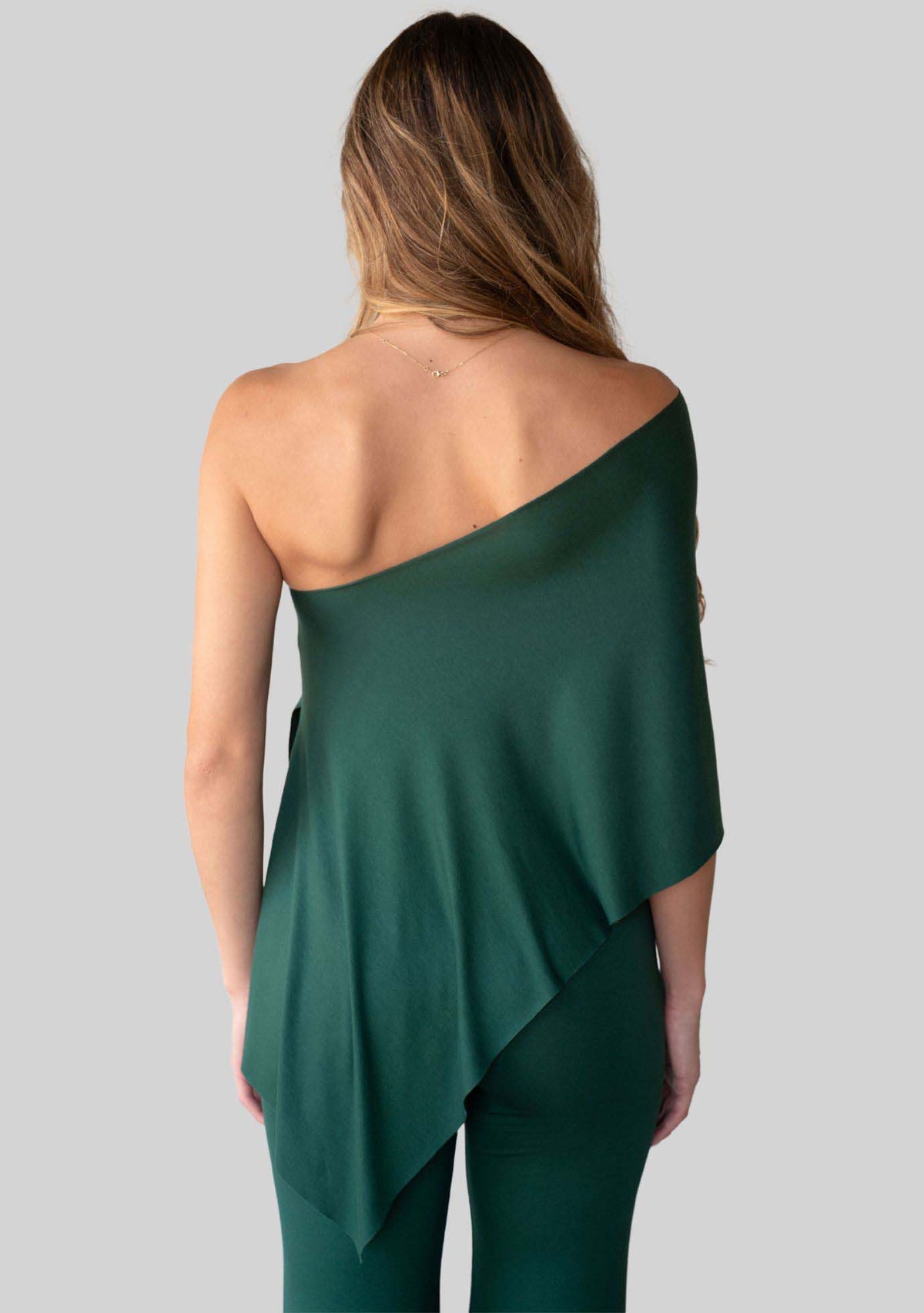Evergreen Unwind Poncho, one shoulder style, back view. 